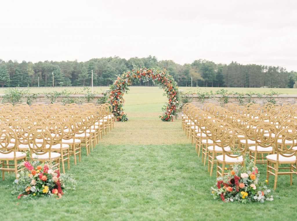 outdoor wedding ceremony floral arch backdrop