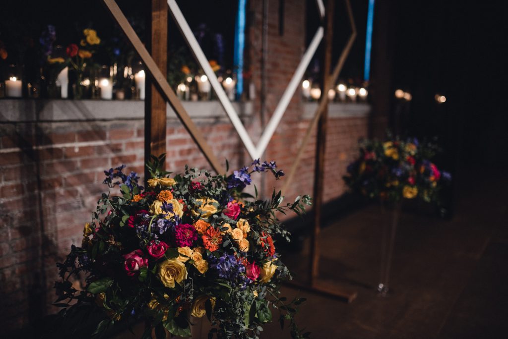 jewel toned wedding ceremony flowers 
