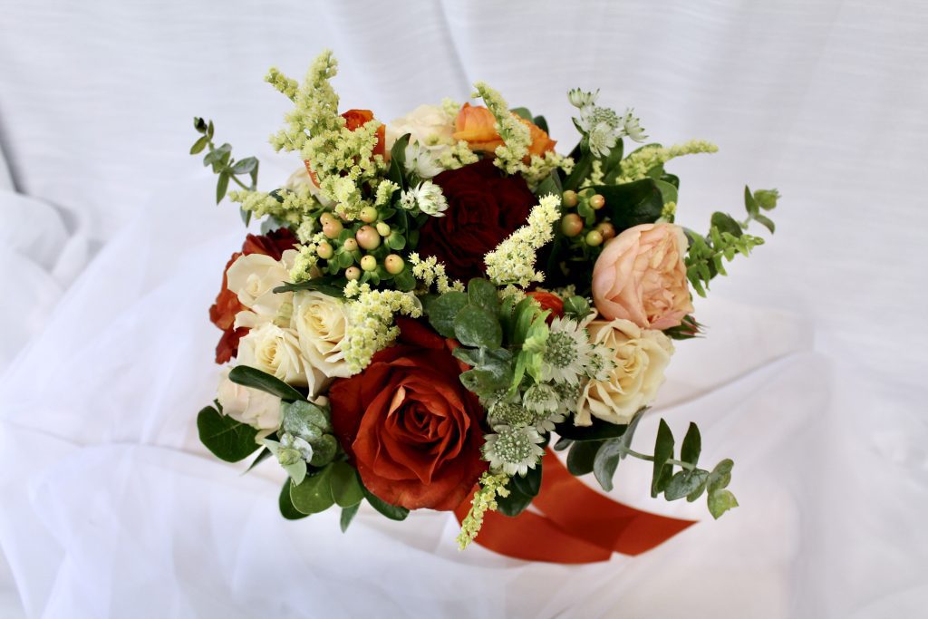 seasonal fall color palette handheld bouquet Homecoming flowers